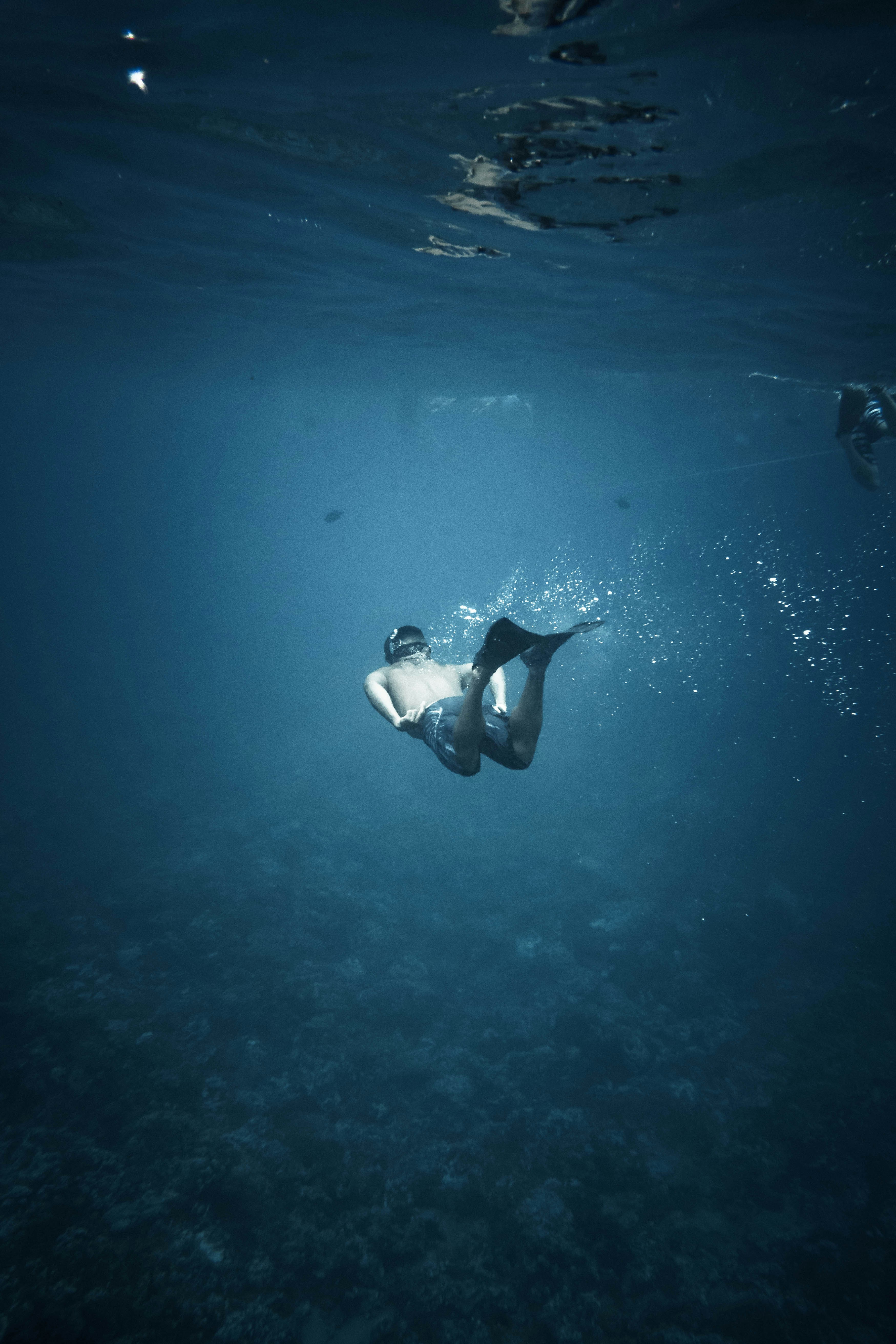 man swimming in the ocean